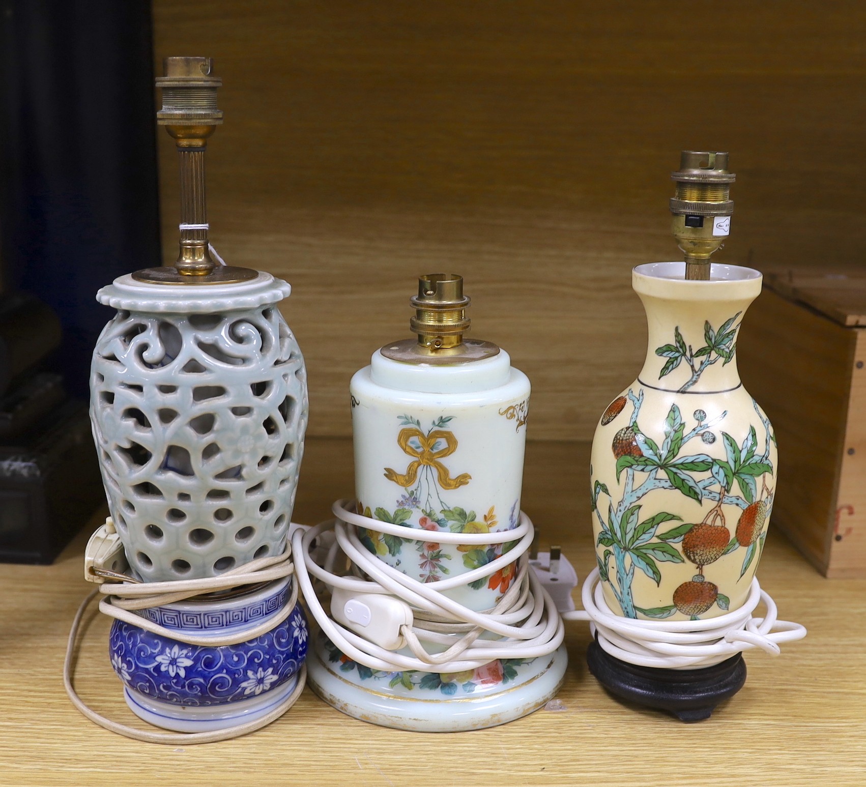 A 19th century floral decorated glass lamp and two Chinese lamps, tallest 26cms high